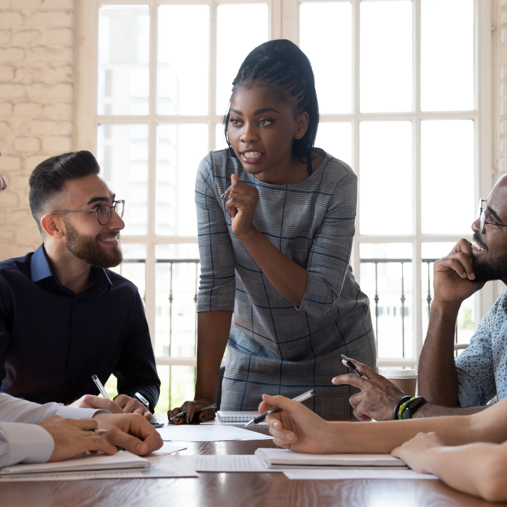 Female,Black,Executive,Leader,Talking,To,Happy,Diverse,Employees,Group